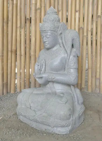 Product image 4 of the product “Seated Dewi Sri, position chakra turning the wheel, 73cm high riverstone grey, model with sativa. There is a stone eye on the left temple. ”